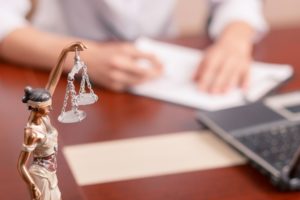 Picture of immigration attorney filling out paperwork for clients